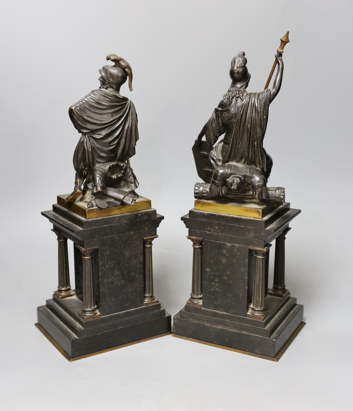 A pair of late 19th century bronze classical revival figures of a Roman god and goddess, black slate pedestals., tallest 31cms high.
